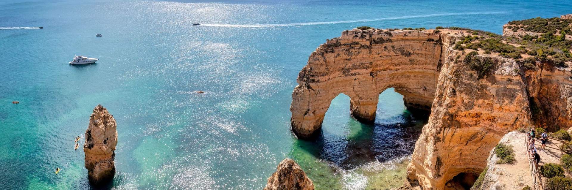 Algarve filming location at the southern Portugal coast — Faro, Lagos, Sagres and Tavira run independent Câmara permit tracks under the FATC mainland rate