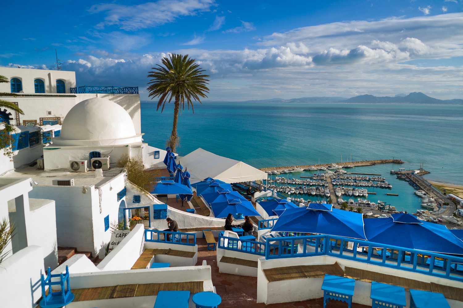 Sidi Bou Said Tunisia Mediterranean cameo — blue-and-white clifftop village outside Tunis, line production stand-in for Cycladic Greek frames